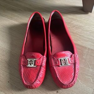 Ladies Tory Burch driver moccasins in orange.